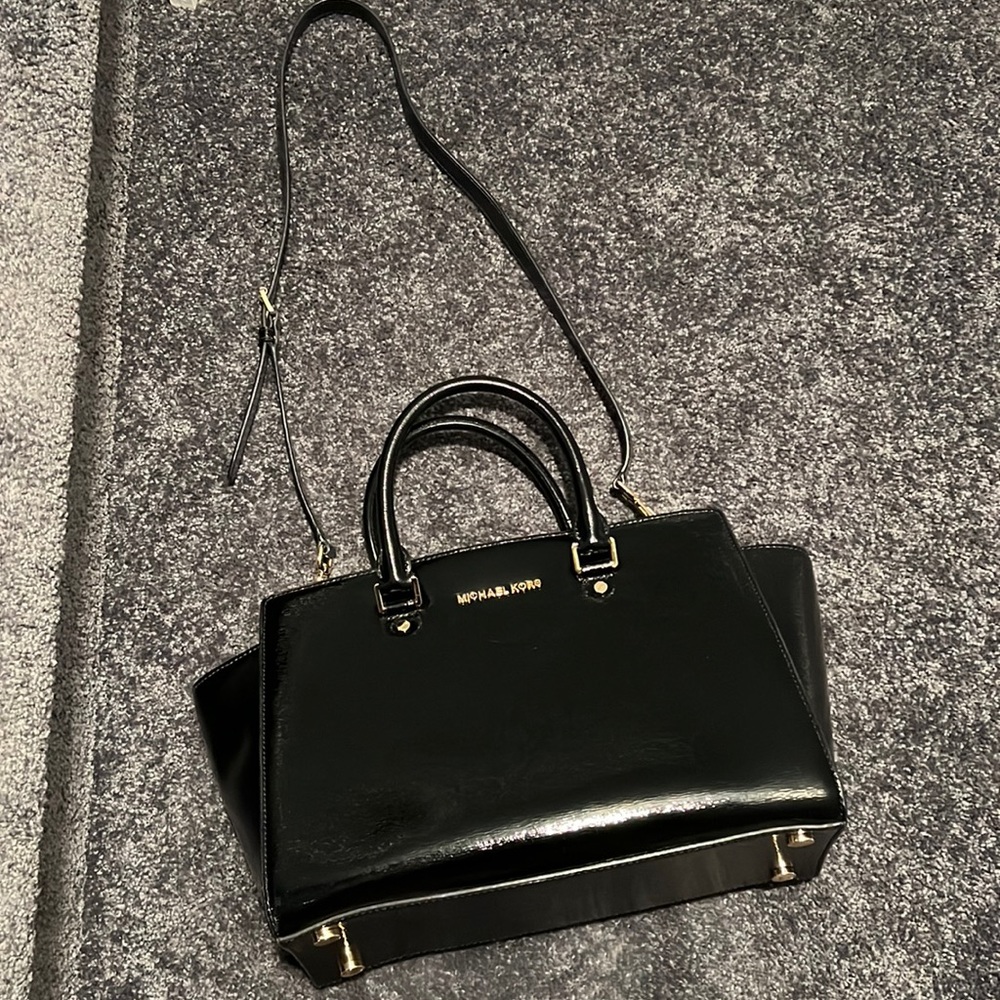 Michael Kors black patent leather hand bag.
